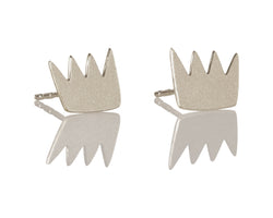 Silver crown earrings attached to the ear