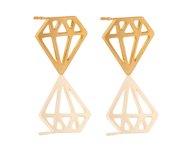 Golden earrings in the shape of a diamond close to the ear