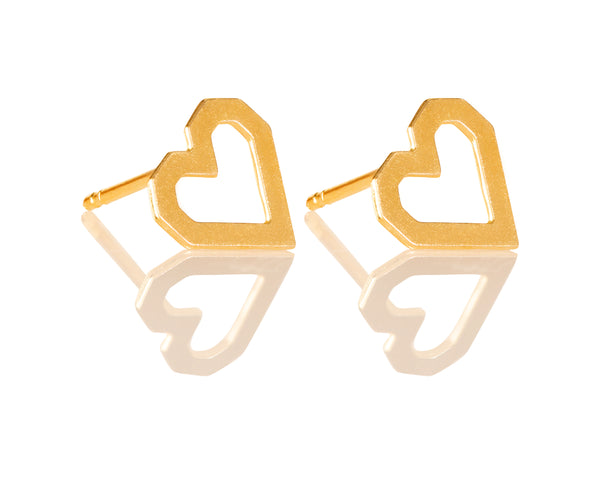 Pixelated heart earrings attached to the ear