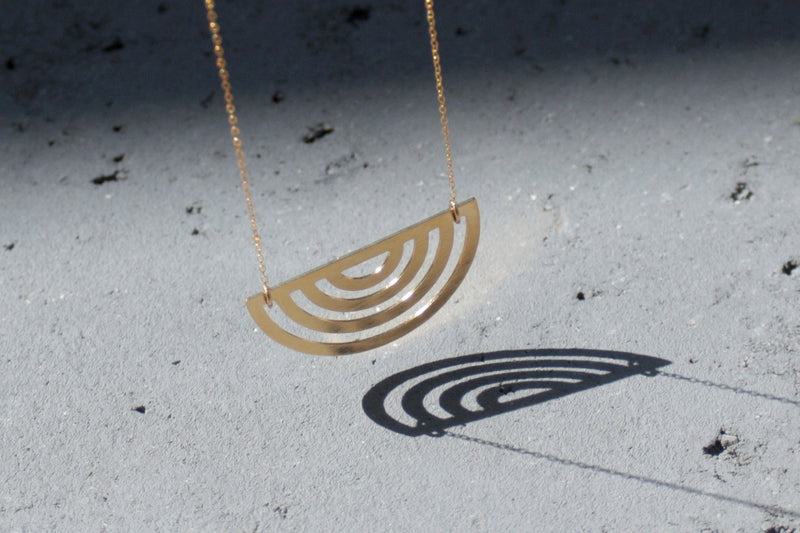 Long geometric half circle necklace