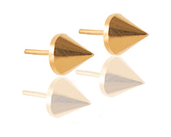 Minimalist gold spike earrings close to the ear