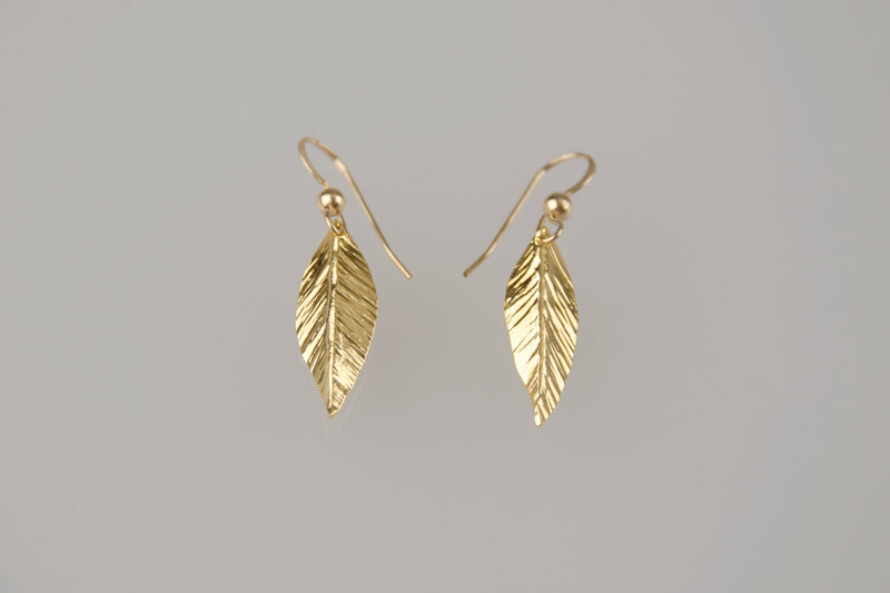 Gold dangling leaf earrings