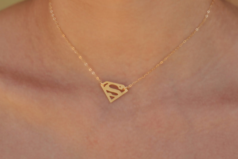 Small gold choker superman necklace