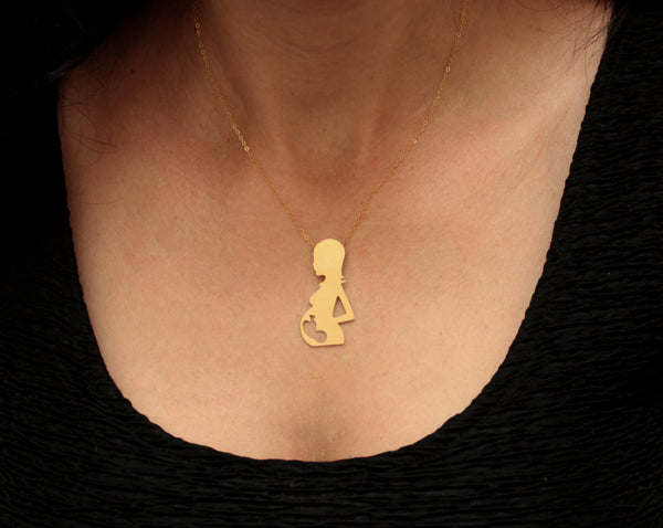 A pregnant woman necklace with a fetus