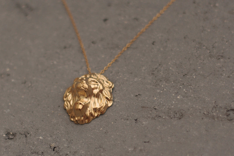 Large lion head necklace in gold