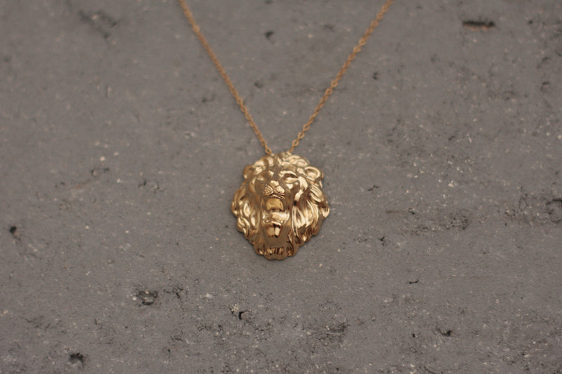 Large lion head necklace in gold