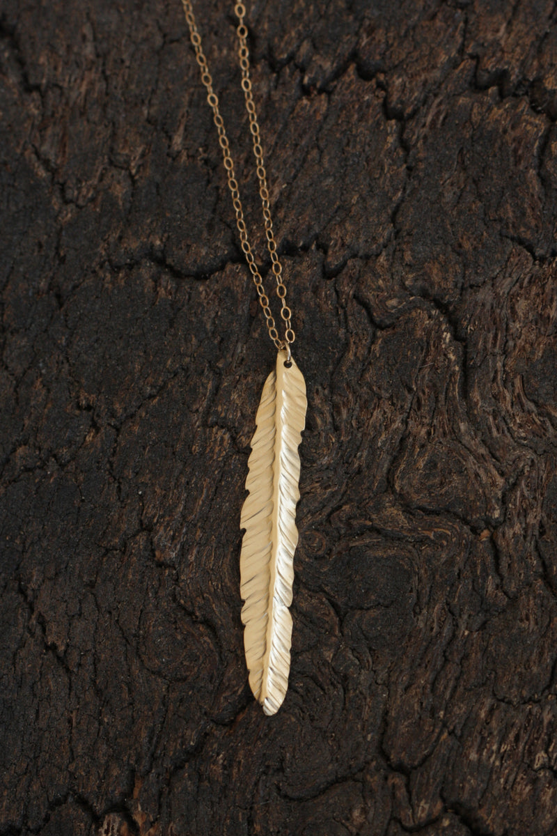Long golden feather necklace