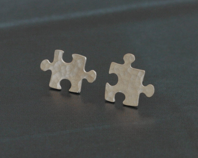 Small tight silver puzzle earrings