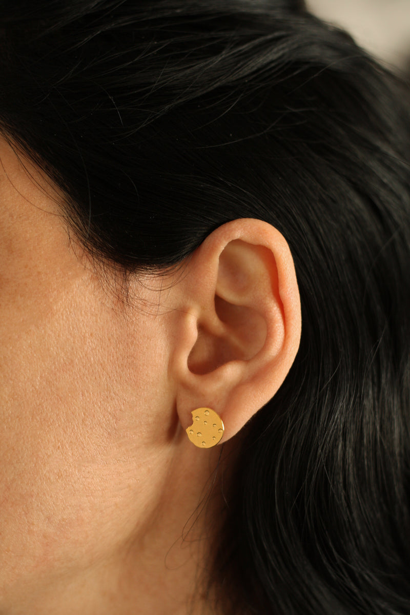 Chocolate chip cookie earrings attached to the ear