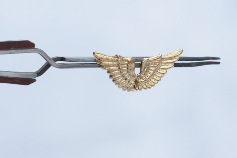 Wing earrings close to the ear