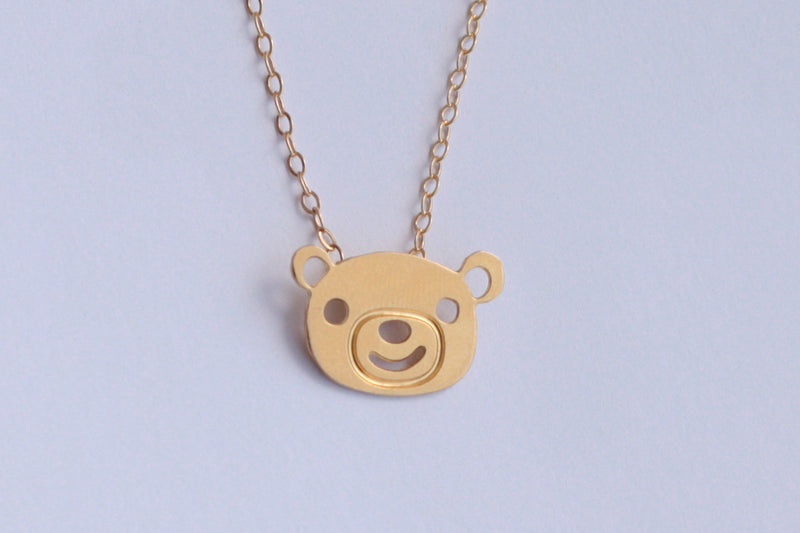 Small gold bear necklace