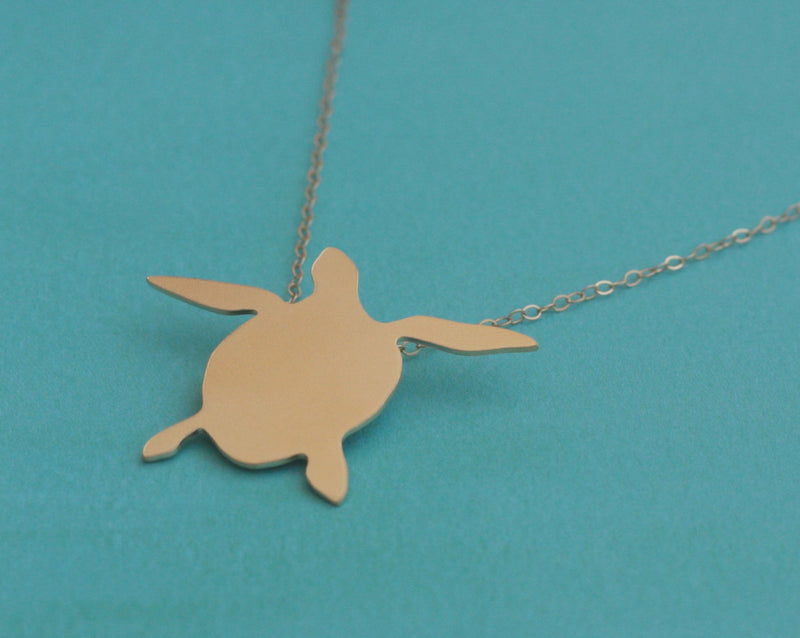 Gold sea turtle necklace