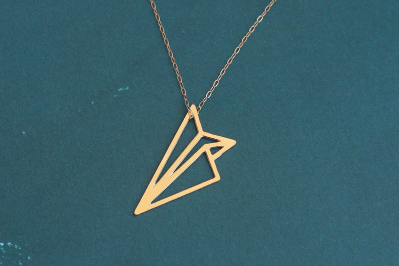Paper airplane necklace