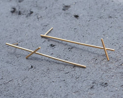 Long tight asymmetrical bar earrings in gold