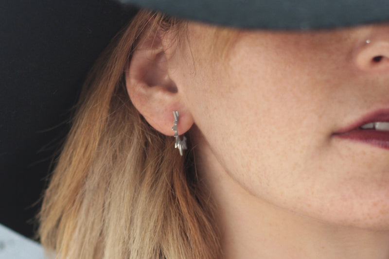 Studded silver sun spike earrings
