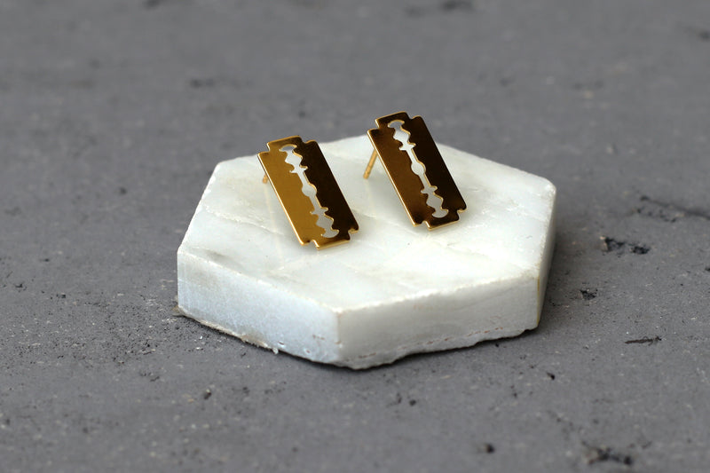 Attached gold cutting knife earrings