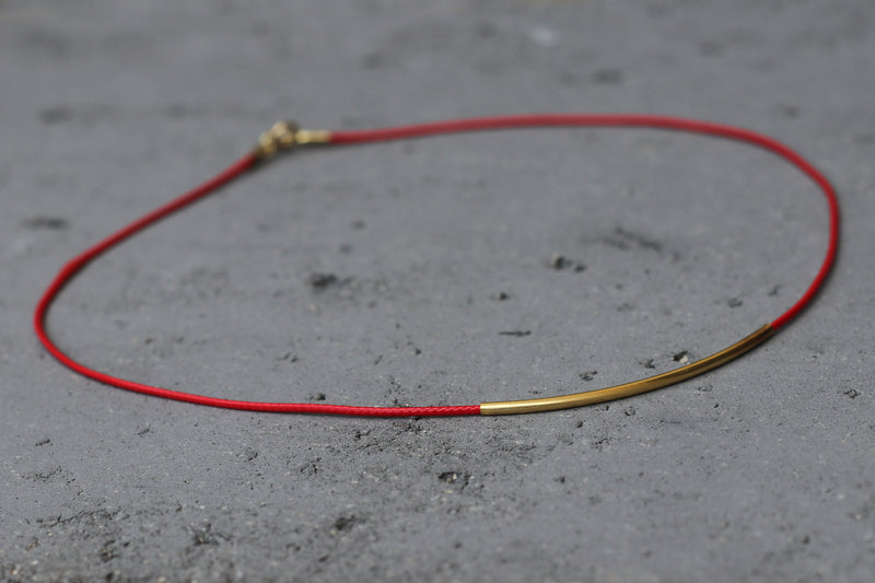 Red leather chain with gold tube