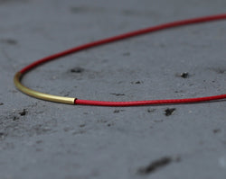 Red leather chain with gold tube