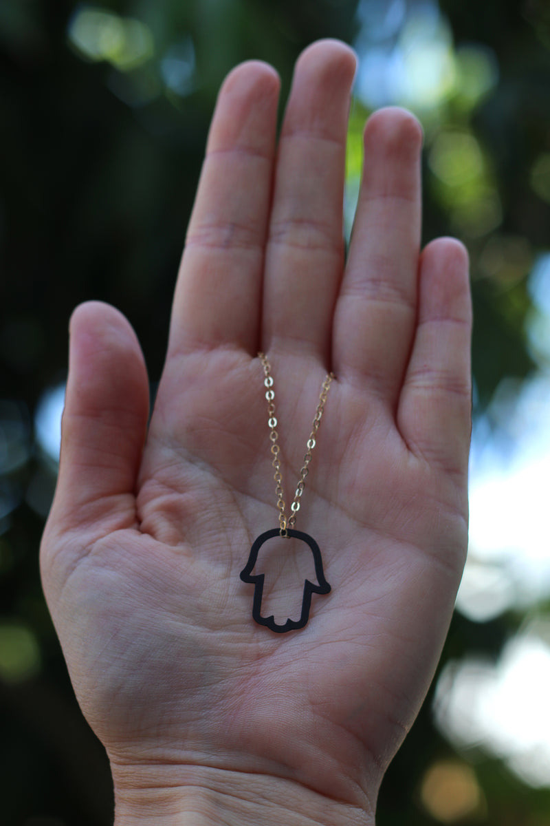 Gold filled necklace with hollow black hamsa pendant