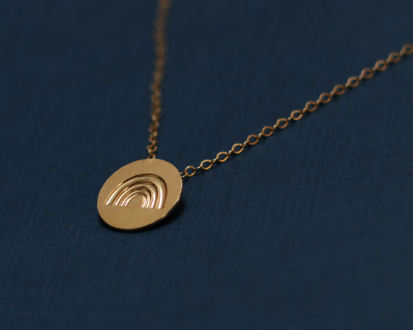 Circle necklace with gold rainbow