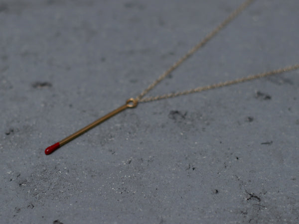 Gold match necklace