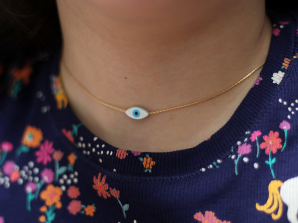 A close-fitting Eye Tova necklace, a choker necklace from Goldfield