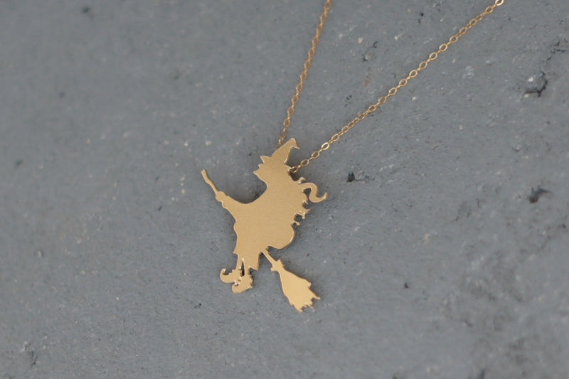 Gold Witch on a broom Necklace