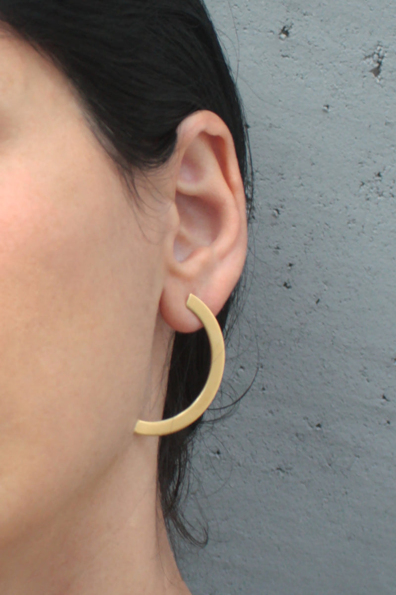 Large and long semi-circle earrings attached in gold