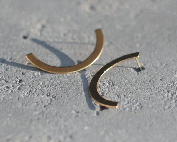 Large and long semi-circle earrings attached in gold