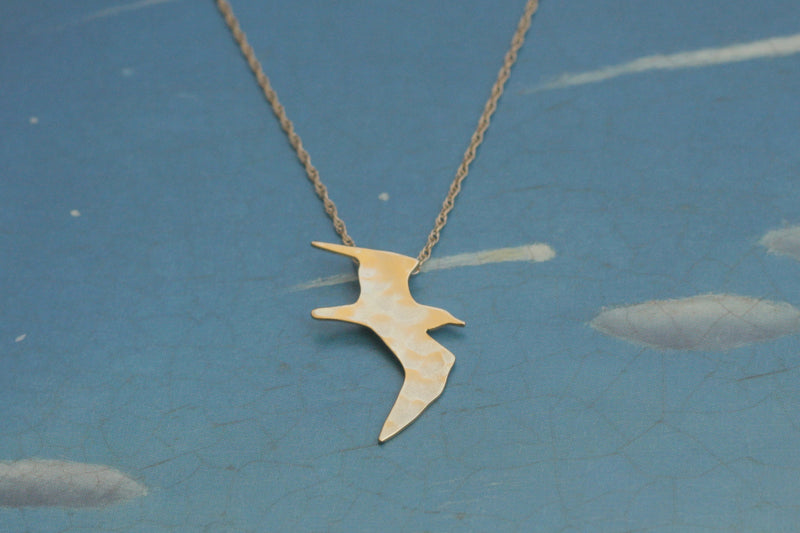 Gold plated flying bird necklace