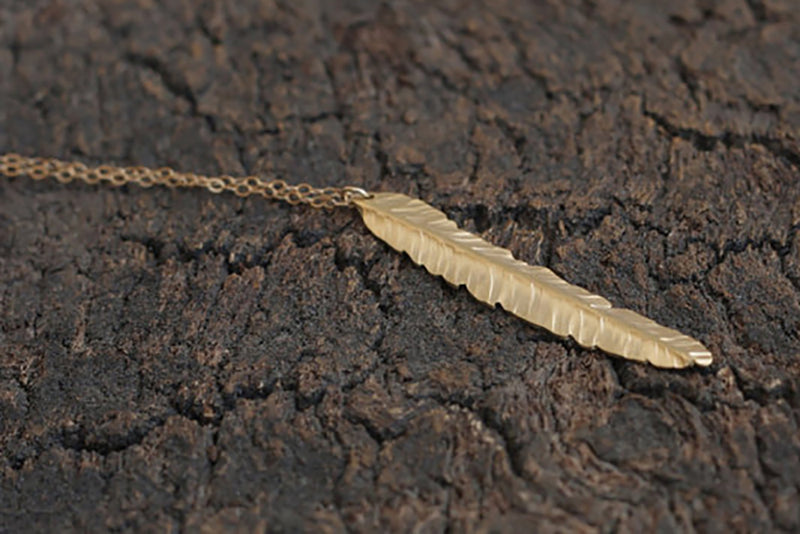 Long golden feather necklace